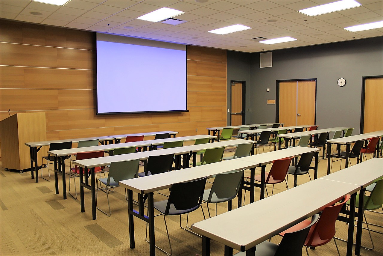 Meeting Room A at Main Library arranged with tables for meetings, classes, workshops, and presentations.