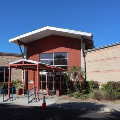 Front view of Palm View Branch Community Center featuring the library entrance, landscaping, and welcoming exterior.